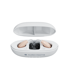 Load image into Gallery viewer, Top view of Audien Ion Pro hearing aids resting in labeled charging case with open lid