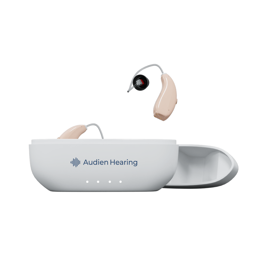Audien Ion Pro hearing aids with one in charging case and one suspended above, front view